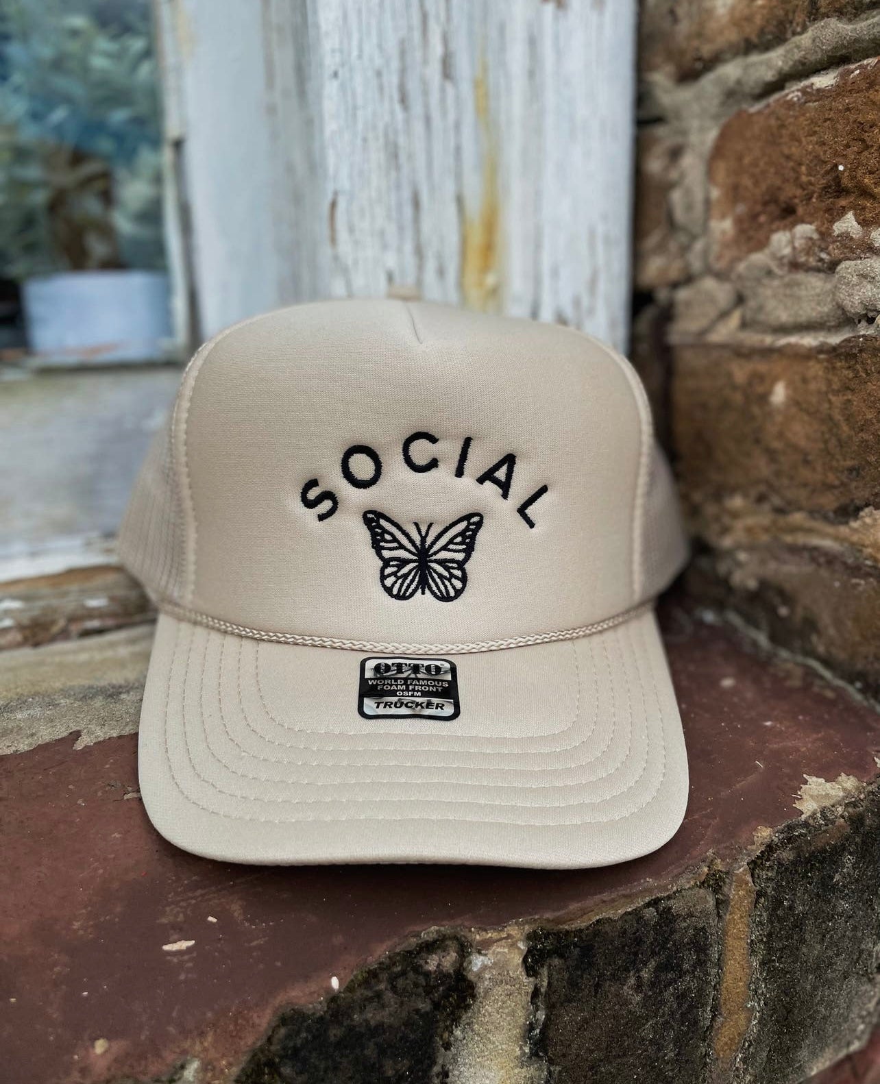 Social butterfly trucker hat