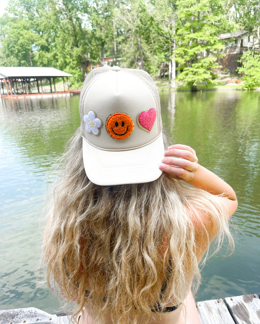 Tan smiley trucker hat